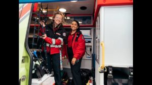 Two Superior Ambulance EMTs smile on emergency ambulance